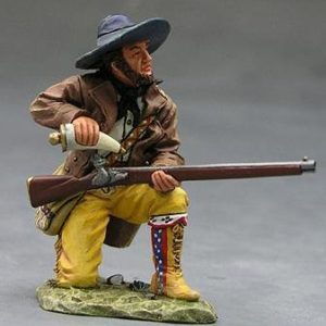 Juan A. Badillo in ginocchio che ricarica il fucile