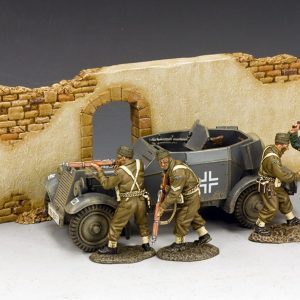 As one Commando struggles with a German guard the other two shelter next to an Adler Kfz.13 Armoured Car... Wall Section included.