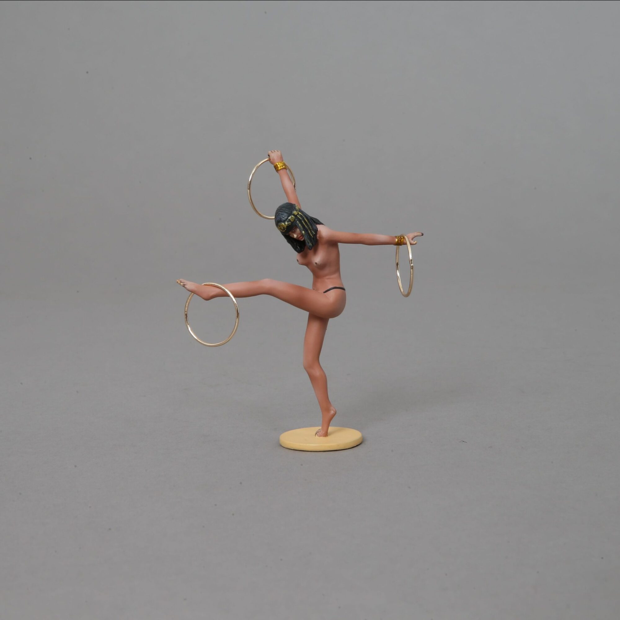Dancer with brass rings