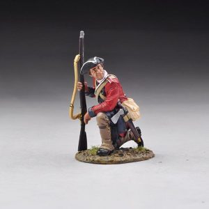 A kneeling rifleman looks left before preparing to move off.