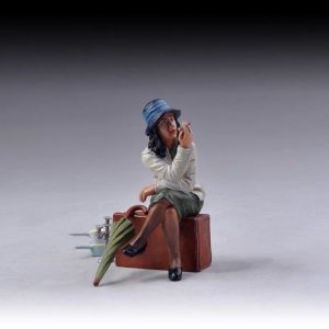 young lady smoking a cigarette whilst perched on a suitcase