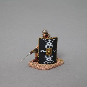 kneeling legionnaire with Pilum lowered waiting in reserve before going into battle