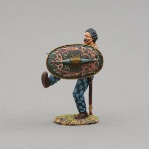 Ancient Briton adorned with tattoos holding ornate green shield decorated with mythical waterbirds