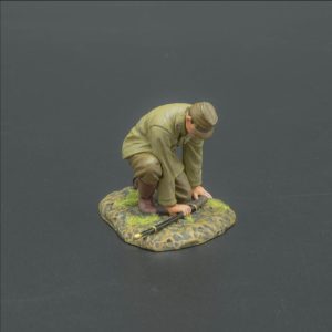 Kneeling Japanese officer laying down Katana sword