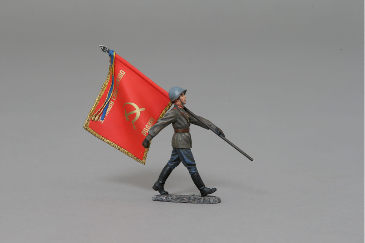 Soviet soldier with Red Army banner marches