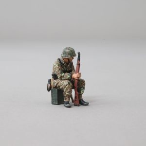 Soldier Sitting on Crate with Rifle