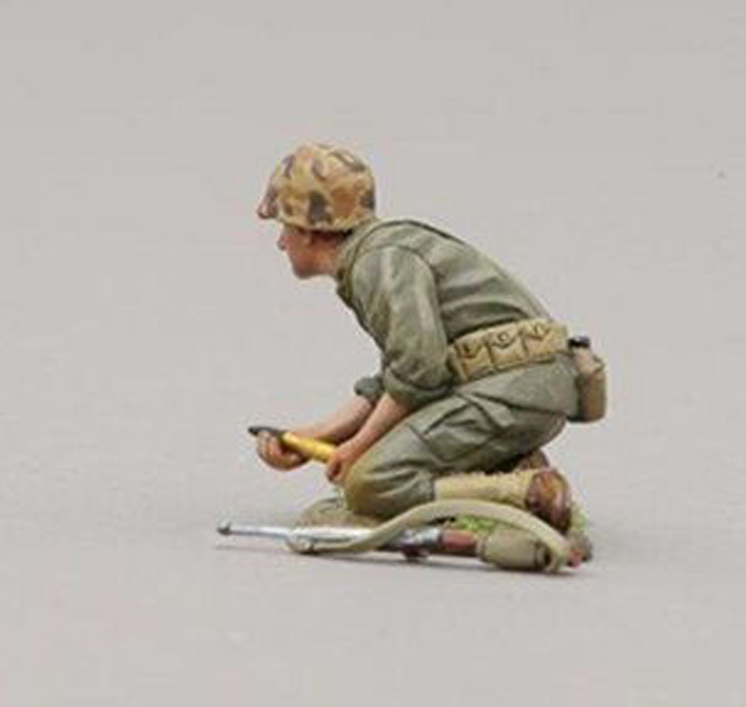 USMC soldier prepares to insert ammunition into the 37mm cannon