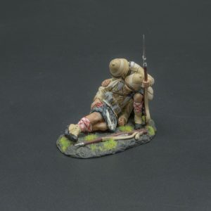 A kneeling Highlander listens to the last request from one of his badly wounded comrades