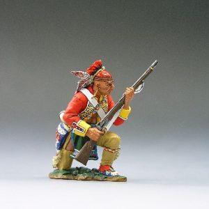 Indiano in ginocchio col fucile pronto al fuoco